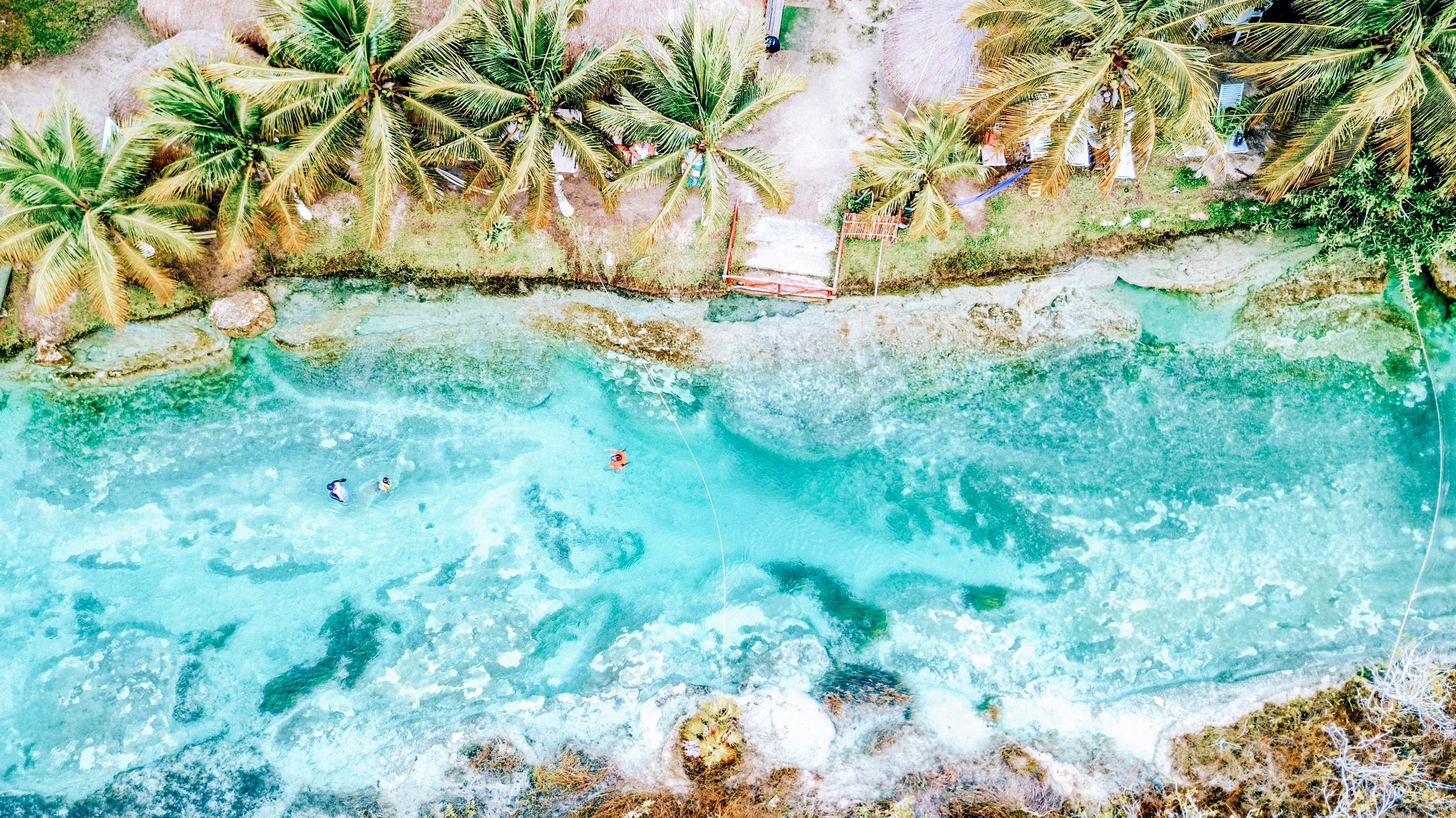 Tulum beach with Mayan ruins on cliffside